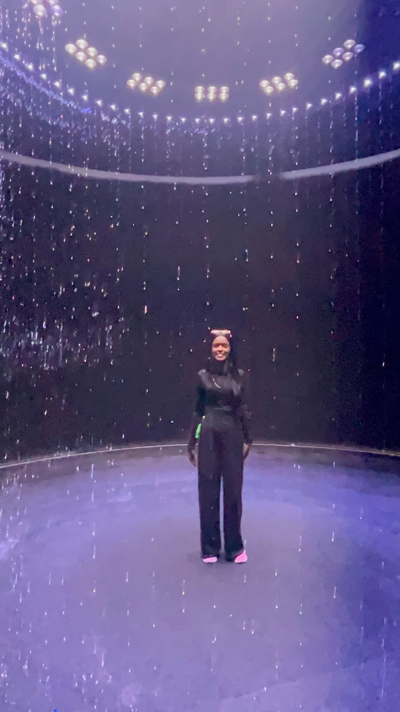 Sahar Ali inside an immersive light installation